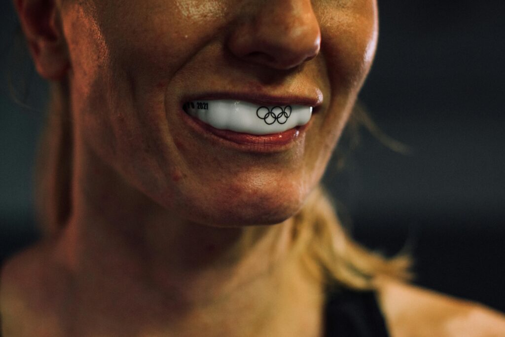 woman preparing for a boxing match by wearing mouthguards Fort Worth TX