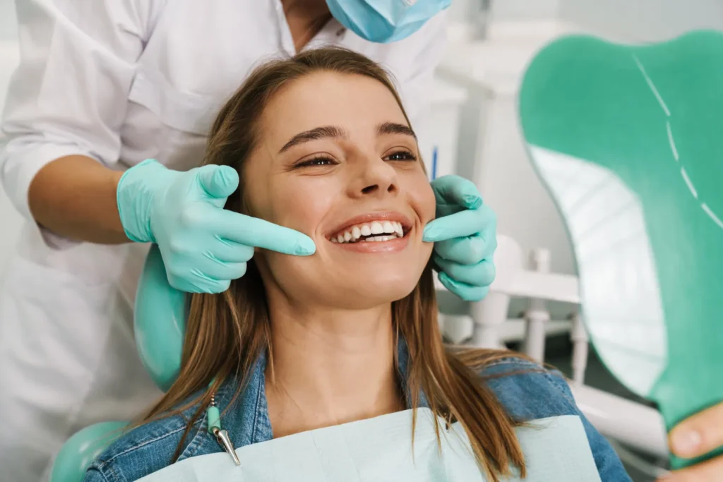 young woman smiling in her dentist appointment